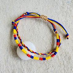 two bracelets that are on the ground