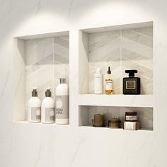 three shelves with bottles and soaps on them