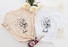 two t - shirts with the words bride and flower on them next to a bottle of booze