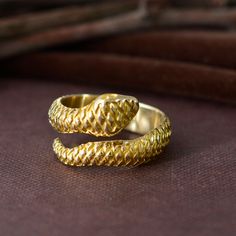 "Vintage Gothic Golden Snake Men's Ring, Twisted Snake Ring, Snake Serpent Band, Adjustable snake ring, Halloween jewelry, gift for her. ❥ The serpent is one of the oldest mythological symbols representing good, evil, wisdom and eternity.  During the early centuries after the Renaissance, snakes were a common theme in mourning jewelry intended to become a symbol of the purification of the corpse and its return to earth. ❥ The brass metal will develop a nice antique color over time. So, I suggest cleaning it once in a while for getting back to the shiny original color. You can use natural ingredients like lemon or vinegar with water to clean it. Also, apply a thin coat of transparent nail paint/nail enamel on the ring's inner side to save it from being tarnished. All our products are Nickel Adjustable Snake Ring Gift, Brass Snake Ring Open Shape Gift, Brass Snake Ring Open Design For Gift, Brass Open Snake Ring Gift, Handmade Snake Shaped Ring As Gift, Unique Snake-shaped Rings As Gifts, Black Obsidian Ring, Gold Wrap Ring, Golden Snake