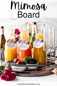 a tray full of drinks with the words mimosa board in front of it