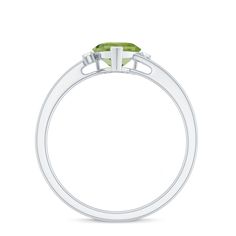 Product Details This elegant promise ring features a heart shape Peridot gemstone at its center, complemented by sparkling Diamond on either side. The peridot stone boasts a lovely light green hue and is expertly cut to showcase its beauty. The heart shape of the stone symbolizes love and commitment, making it a perfect choice for a promise ring. The Diamond adds an extra touch of elegance and sparkle to the design. This ring is a timeless piece of jewelry that will be cherished for years to come. Product Information SKU SHP-RINGS082219748 Width 6.5 mm Height 4 mm Weight 1.84 gm (Approximate) PERIDOT INFORMATION No.of Stones 1 Pieces Total Weight 0.90 Carat (Approximate) Dimension(approx) Heart-6X6 mm-1 Pcs Color Green Cut Brilliant Shape Heart Setting Type Prong-Setting Quality Grade AAA A Promise Ring, Peridot Stone, Ring With Diamond, Sparkling Diamond, Peridot Ring, Peridot Gemstone, 18k Yellow Gold Ring, Ring Sizer, Sparkle Diamonds