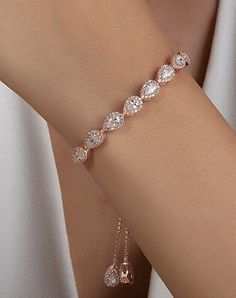 "Perfect for brides, bridesmaids, mother of the bride, mother of the groom or maid of honor. A piece of jewelry that you are going to wear for years to any special occasion. An elegant silver bridal bracelet - perfect for your wedding day or as a gift for your bridesmaids. The bracelet in silver has the most beautiful sparkle with  cubic zirconia stones. If you want to combine it with earrings and necklace, I leave the link here. https://www.etsy.com/uk/listing/1276071109/silver-teardrop-crystal-bridal-necklace https://www.etsy.com/uk/listing/1243959614/silver-teardrop-crystal-bridal weight:8.22g * Handmade with love ♡ * Material: 925 Sterling Silver * Standard Bracelet Length: 16 + 4cm extension. If you need it longer or shorter, please leave us a message. * Finish: 18K Gold, 18k Rose Gol Bride Bracelet, Nails Jewelry, Bracelet In Silver, Bracelet Wedding, Silver Ornaments, Nail Jewelry, Earrings And Necklace, Bridal Bracelet, Custom Name Necklace