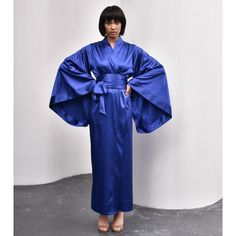 This silky kimono robe strikes the perfect balance between elegance and femininity. With its satin finish, dramatic hemline, and flowing sleeves, it creates a striking silhouette that feels effortlessly luxurious. A beautiful addition to your wardrobe and a thoughtful gift for someone special.  Made in our signature satin blend, it’s as comfortable as it is elegant. This kimono is a wrap over style, there are two sets of inside ties. Wide obi-tie is included  Kimono Length - 58 ''/147 cm Polyami Flowing Sleeves, Maxi Kimono, Brand Magazine, Stocking Fillers For Her, Forever Jewelry, Jewelry Ring Box, Alternative Wedding, Water Temperature, Mens Jewelry Bracelet