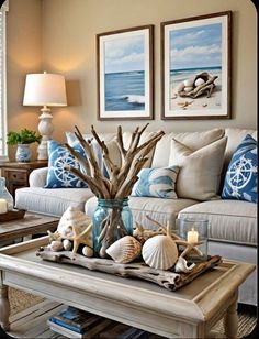 a living room filled with furniture and pictures on the wall next to a table covered in seashells