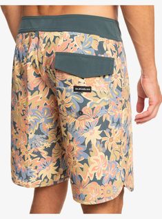 These florals can fly. Down the line that is. Backed with Quik's exclusive SurfSilk fabric and 4-way stretch, they're primed for the ride of your life. Get into the SurfSilk Scallop Boardshort for men and watch your surf style bloom. Features Eco-Conscious Fabric: 4-way stretch recycled polyester elastane blend fabric Sustainable SURFSILK fabric, tough on the outside, durable on the inside Coating: Plant-based hydrophobic coating Fit: Performance scallop fit Waist: Elastic back waistband Fly: Pe Multicolor Bottoms For Spring Surfing, Printed Multicolor Surfing Bottoms, Multicolor Printed Bottoms For Surfing, Spring Surfing Swim Trunks, Spring Surfing Shorts, Surf Style, Recycle Plastic Bottles, Board Shorts, Plant Based