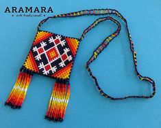 Dimentions Length 16.5 inches (41.91 cms) The pouch area is 2.6 x 2.6 inches (6.60 cms) In this necklace, you'll see a representation of the Ojo de Dios or Eye of god. For the Huichol people, the Ojo de Dios or God's eye is symbolic of the power of seeing and understanding that which is unknown and unknowable, The Mystery. The four points represent the elemental processes: earth, fire, air, and water. The Huichol represent one of the few remaining indigenous cultures left in Mexico. They live in Sierra Madre Occidental, Pouch Necklace, Eye Of God, God's Eye, Art Perle, Native American Necklace, Huichol Art, Gods Eye, Mexican Jewelry