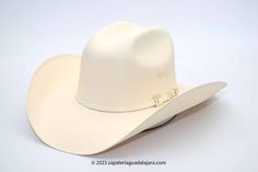 TOMBSTONE 1000X TELAR ESTE-OESTE | Genuine Leather Vaquero Boots and Cowboy Hats | Zapateria Guadalajara | Authentic Mexican Western Wear White Flat Crown Country Hat, White Country Hat With Flat Crown, White High Crown Hat Bands For Rodeo, White Flat Crown Hat For Rodeo, Western Style White Top Hat With Flat Crown, Classic White Hat With High Crown, Classic White High Crown Hat, White Western Hat For Formal Occasions, Classic White Top Hat With Flat Crown