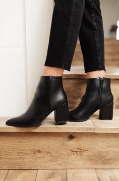 The Amari Ankle Boots are so chic and cute you'll want to wear them with every outfit! In a stunning faux leather, shaped from a pointed toe, and ankle length silhouette, these boots were made for walking! Faux leather + Pointed Toe Heel height: 2 1/2" Shoe height: 5" Zipper length: 5" Keywords: Ankle Boots, Pointed Toe, Black Boots Romantic Minimalist, Work Fits, Thrift Haul, Style Goals, Winter Shoes, Black 7, Korean Outfits, Black Booties, Black Ankle Boots