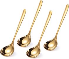 three shiny gold spoons on a white background