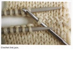 two crochet links are being used to knit the stitchs in this photo