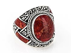 Artisan Collection of Bali™ 14x11mm Oval  Red Coral Inlay Sterling Silver Textured Ring. Measures Approximately 0.88"L x 0.80"W. Oxidized. Not Sizeable Artisan Red Jewelry For Anniversary, Artisan Red Ring For Gift, Red Oval Bohemian Rings, Artisan Red Ring Jewelry, Artisan Red Oval Jewelry, Red Bohemian Jewelry For Anniversary, Bohemian Red Jewelry For Anniversary, Red Round Artisan Jewelry, Artisan Red Round Jewelry