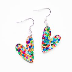 These Small Confetti Heart Acrylic Earrings go perfectly with any color outfit and also make a great gift! They are hypoallergenic and lightweight.  SIZING: Hearts are approximately 7/8 inch wide & 1 1/8 inches long. Drop length is approximately 2 inches.  MATERIALS: Silver stainless steel earring hooks are hypoallergenic and will not tarnish. Jump rings are sterling silver. Earrings are made of acrylic.  PACKAGING: Earrings arrive in a cotton filled swirl white jewelry box gift case. Perfect fo Girly Earrings, Packaging Earrings, Acrylic Packaging, Rainbow Polka Dots, Earrings For Girls, White Jewelry Box, White Jewelry, Earring Hooks, Pretty Earrings