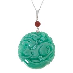 Kwan Collections Carved Jade Dragon Pendant with 18" Chain  Celebrate the Chinese Year of the Dragon with this expertly-carved green jade dragon pendant. Dragons represent strength and good luck in many eastern cultures. This pretty piece features a faceted red jade accent, silver enhancer bail and includes an 18" chain necklace.        Pendant approx. 3-1/8"L x 2"W     Chain approx. 18"L x 1/16"W with 2" extender     Stamped .925     Enhancer bail     Round green jade pendant has carved dragon design     Carved piece topped with round, faceted red jade bead accent     Comes with rope chain necklace; spring ring clasp   Stone Information       All sizes and weights approximate     Color-Enhanced Green Jade - Round carved (50mm)     Color-Enhanced Red Jade - Faceted bead (8mm) Traditional Engraved Jade Necklace, Green Carved Amulet Necklace, Carved Jade Pendant Jewelry, Carved Silver Jade Necklace, Carved Silver Jade Necklaces, Carved Jade Necklace In Silver, Carved Jade Pendant Necklace, Carved Jade Jewelry For Good Luck, Green Carved Round Pendant Jewelry