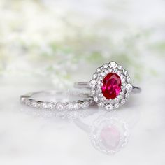 Beautiful Vintage Inspired Ruby Ring Made of Solid Sterling Silver, Rhodium Plated (925) Can be paired with one or two half-eternity Milgrain bands of your choice Accented with Simulated Diamonds (CZ) Center Stone: Ruby Grade: AAA Stone Cut: Oval Gem size: 7.0 x 5.0 mm Carat Weight: 0.76 (approx.) Gemstone creation: 100% Genuine Lab-Grown Ruby Stone Origin: Russia Handling time: 1-2 business days Free domestic shipping. Usually takes 2-5 business days. Wrapped & ready to give in a beautiful Oval Ruby Ring, Vintage Ruby Ring, Ash Jewelry, Ruby Ring Vintage, Memorial Jewelry Ashes, Yellow Jewelry, Ashes Jewelry, Ruby Engagement Ring, Sterling Silver Engagement Rings