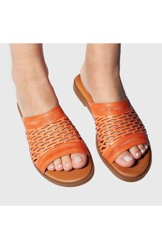 Add the perfect finishing touch to your warm-weather looks in this slide sandal fitted with a cushioned footbed to keep you stepping comfortably. A rich leather upper in a netted design encases your foot for ultimate support. 1" heel Leather upper and lining/rubber sole Imported Leather Slip-on Sandals For Beach, Casual Orange Slip-on Mules, Comfortable Slip-on Sandals With Textured Sole, Summer Leather Footbed Slip-on Slides, Leather Slippers With Cushioned Footbed For Vacation, Leather Slides With Textured Footbed For Spring, Spring Synthetic Slides With Leather Sole, Slip-on Leather Slippers For Summer, Comfortable Leather Slides With Round Toe