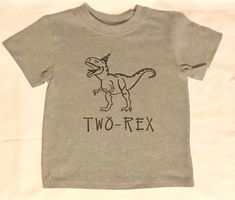 Custom vinyl TWO-REX birthday shirt. Vinyl color can be changed to fit your needs. Made in a smoke free and pet free home. Thank you for stopping by! Have a blessed day! Etsy Baby Clothes, Toddler Boy Birthday, 2nd Birthday Boys, Dino Shirt, Dinosaur Themed Birthday Party, Dino Birthday Party, Dino Birthday, Baby Boy Birthday, Birthday Boy Shirts