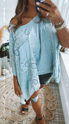 Step into spring with style this fun and flowy eyelet top is sure to make you stand out this season! The Oversized Eyelet Shirt has a mineral-washed finish and playful eyelet details throughout, this top is perfect for embracing the spring vibes. Plus, the oversized fit ensures extra comfort and style all season long! Eyelet cutout detail Oversized Mixed fabric High-low hem. Functional front pocket Fabric: 100% Cotton Fit: Oversized fit you 100% can size down in this! Model Specs: Syd is wearing a size XL in the photo. Karli is wearing a size small in the photo. How will this item fit you? Check out our MODEL SPECS(Typical Sizing - Karli: S-Size 5/26 - 5ft 2in, Emily: S-Size 3/25 - 5ft 5in, Syd: L/XL- Size 15/ - 5ft 8in)﻿Need help with sizing? No problem! Join our VIP group on Facebook, Ev Summer Pointelle Knit Top For Loungewear, Light Wash Cotton Tops For Vacation, Cotton Eyelet Long Sleeve Tops, Light Wash Cotton Beach Top, Bohemian Eyelet Top For Spring, Spring Bohemian Blouse For Loungewear, Oversized Light Wash Tops For Spring, Spring Bohemian Eyelet Top, Washed Blue Stonewashed Tops For Spring