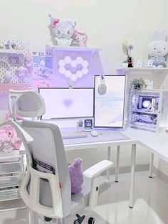 a white desk topped with two computer monitors