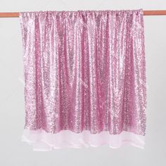 pink sequin curtains hanging on a clothes line