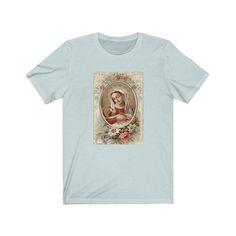 Beautiful shirt featuring the Virgin Mary and baby Jesus. This is the perfect gift for yourself or loved ones! 100% super soft cotton short sleeve Tshirt. Vintage + distressed design. ♡ Measurements: Available in sizes S-3XL Comfy, unisex tee. Roll up the sleeves and tie the shirt for an adorable fit! If you prefer a tighter fitting shirt, we recommend sizing down. *If you prefer women's fit or V-neck, leave us a note and we can customize for you!* Care Instructions: Machine wash: warm Tumble dr Blue Short Sleeve T-shirt For Gift, Soft-washed Crew Neck T-shirt As Gift, Blue T-shirt For Mother's Day Gift, Virgencita Shirt, Silver Spiritual Virgin Mary Jewelry, Christian Sweaters, Christ Shirts, Grandparents Ornament, Prayer Group