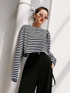 Material : Cotton Color : black and white stripe Size : S，M，L S: bust: 108cm, shoulder: 46cm, length: 42cm, sleeve length: 66cm S: bust: 112cm, shoulder: 47cm, length: 43cm, sleeve length: 67cm S: bust: 116cm, shoulder: 48cm, length: 44cm, sleeve length: 68cm Striped Long Sleeve Top For Fall, Fall Striped Long Sleeve Top, Spring Long Sleeve Tops With Vertical Stripes, Black Long Sleeve Tops With Striped Hem, Black Long Sleeve Top With Striped Hem, Black Tops With Horizontal Stripe Pattern For Fall, Black Vertical Stripes Top For Spring, Black Vertical Striped Top For Spring, Casual Black Tops With Striped Cuffs