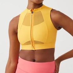 Recycled Nylon Jersey And Mesh Sport Bra. Paneled Construction Round Neck Zip Closure Elasticized Hem Logo Bonded At Side Seam Cutout At Back Hook-Eye Fastening At Back Waist Supplier Color: Mango Body: 78% Recycled Nylon, 22% Elastane. Trim: 81% Nylon, 19% Spandex. Made In Turkey. 222487f561018 Yellow Stretch Sports Bra For Yoga, Yellow Sleeveless Activewear For Sports, Yellow Sleeveless Sports Activewear, Yellow Sleeveless Sportswear Activewear, Spring Nylon Sports Bra With Medium Support, Spring Nylon Sports Bra In Athleisure Style, Yellow Stretch Sports Bra For Workout, Yellow Stretch Sports Bra, Yellow Sleeveless Sports Bra For Gym