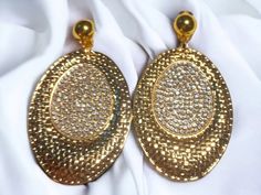 large style  Hammered gold disc With hand applied rhinestones  These hang 4 inches Gold clip on closure Very lightweight  Pairs beautifully with other gold accessories Glamorous Gold Clip-on Earrings With Rhinestones, Gold Clip-on Earrings For Party Costume Jewelry, Gold Clip-on Costume Jewelry Earrings For Parties, Gold Costume Jewelry Clip-on Earrings For Parties, Party Gold Bling Clip-on Earrings, Gold Disc, Gold Clips, Hammered Metal, Hammered Gold