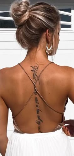 a woman with a tattoo on her back