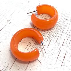 Orange hoop earrings in a vintage lucite and a moonglow finish. This style is known as the Leetie Bold Haskell Hoop & it's made with rare vintage parts - moonglow hoops that are authentically vintage are hard to find. These are a hand-dyed style & each hoop measures approximately 1" in diameter and about 15mm in width. This style is known as the Haskell hoop & is the perfect mix of retro and modern styles. The name pays homage to jewelry designer Miriam Haskell who was one of our fav Retro Small Hoop Earrings For Gifts, Small Hoop Retro Earrings For Pierced Ears, Vintage Hoop Earrings As A Gift, Retro Small Hoop Earrings As Gift, Small Retro Hoop Earrings As Gift, Handmade Vintage Small Hoop Earrings, Retro Small Hoop Jewelry Gift, Vintage Round Hoop Earrings With Ear Wire, Handmade Small Hoop Vintage Jewelry