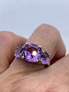 Vintage Purple Amethyst Ring Deco 925 Sterling Silver Sterling Filigree Setting Handmade  can be re sized for you. My jeweler charges $20 Sterling Silver is rhodium finished to prevent tarnish All rings are shipped in a nice gift box.   Check out our over a THOUSAND great reviews Engraving is $4 per letter and is not always perfect depending on the piece. It can take a few days if the jeweler is busy. This is payable to Paypal Judithsltd@gmail.com White Gold Amethyst Ring Stamped 925, Vintage Silver Amethyst Ring, Vintage Silver Amethyst Ring With Intricate Design, Formal Silver Amethyst Ring Hallmarked, Round Cut Amethyst Gemstones, Vintage Purple Sterling Silver Ring, Classic Purple Sterling Silver Gemstones, Vintage Silver-toned Amethyst Ring Gift, Purple Amethyst Ring