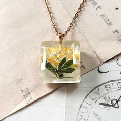 Real pressed flowers, Botanical gift for women, Unique minimalist jewelry, Small pendant for girl, Gift for daughter's birthday. An unusual handicraft as a birthday gift, perfect for a lover of nature and unique jewelry. For women who want to wear unique jewelry in the whole world. Made by me from start to finish with attention to every detail. I put a lot of work, patience and heart into each single piece of jewelry. Personally, I collect and dry plants, which I later use to create.  Pendant si Delicate Jewelry With Natural Inclusions As Gift, Delicate Jewelry With Natural Inclusions For Gifts, Dainty Yellow Jewelry For Gifts, Flower Shaped Pressed Flowers Jewelry For Mom, Dainty Yellow Jewelry For Gift, Dainty Necklace With Natural Inclusions For Gifting, Green Botanical Necklace Perfect For Gifting, White Botanical Jewelry For Gift, Minimalist Yellow Jewelry As A Gift