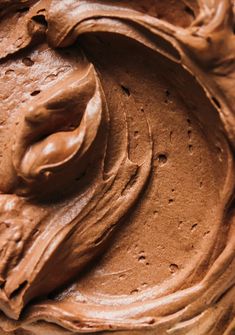 a close up view of a chocolate frosted cake