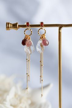 This beautiful pair of gemstone dropping earrings are made with handful of glamour gemstones. Each of them has carefully wired in 14K gold filled. Very detail art work and excellent quality of stones. They are faceted Rock Quartz, Garnet, and Strawberry Quartz. The stones are dangling under a red CZ ear stud with gold filled satellite chain. All jewellery in Artisan Made collection is unique and only one piece available. Let this unique piece be a perfect accessory for your everyday adventures o Briolette Earrings With Gemstone Accents For Anniversary, Gold Dangle Crystal Earrings With Gemstone Accents, Wire Wrapped Briolette Earrings For Anniversary, Briolette Natural Stones Anniversary Earrings, Briolette Earrings With Natural Stones For Anniversary, 14k Gold Filled Gemstone Drop Earrings, 14k Gold-filled Gemstone Drop Earrings, Anniversary Briolette Earrings With Natural Stones, Anniversary Earrings With Natural Stones In Briolette Shape