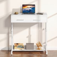 a laptop computer sitting on top of a white desk next to a book shelf with books