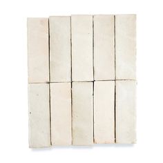 six blocks of white marble against a white background