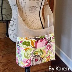 three purses sitting on top of each other in front of a wooden cabinet with writing on it