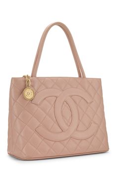 Find CHANEL Quilted Caviar Tote on Editorialist. This Chanel tote bag features quilted caviar leather with a gold tone logo, top handles, and a medallion charm. The bag also has a push lock closure. Luxury Quilted Double Handle Bag, Gold Quilted Top Handle Bag, Chic Bags With Logo Charm For Everyday, Chic Travel Bag With Logo Charm, Elegant Gold Bag With Logo Charm, Luxury Double Handle Shoulder Bag With Gold-tone Logo Plaque, Designer Leather Bags With Logo Charm, Evening Bags With Logo Charm, Chic Gold Bag With Logo Charm