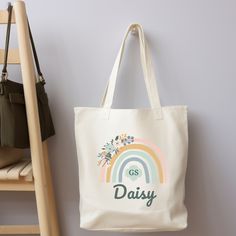 "Show off your Girl Scout Pride with this 100% cotton bag that comes in one size - 15\" x 16\"- perfect for everyday wear. While the canvas material is durable and will last for years. The bag features 20\" handles (made from the same canvas), making it easy to carry even with a week's worth of shopping. .: 100% cotton canvas .: Heavy fabric (12 oz/yd² (406.9 g/m" School Cotton Tote Shoulder Bag, Cotton Tote Shoulder Bag For School, White Cotton Canvas Bag With Canvas Lining, Trendy Cream Cotton Canvas Bag, Casual Cream Cotton Canvas Bag, School Shoulder Bag With Letter Print In Cotton, White Cotton Bags With Canvas Lining, White Cotton Bag With Canvas Lining, Cream Cotton Canvas Tote Bag