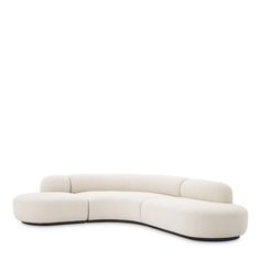 a white couch sitting on top of a wooden floor