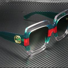 Gucci Square-Frame Acetate Sunglasses Iconic Vnds ((Very Near Deadstock )) Gucci Oversize Sunglasses Transparent Acetate Frame With Green And Red Web Detail-This Detail Is Achieved Using An Exclusive Process. Due To The Techniques Used, Each Pair Of Sunglasses Will Have A One-Of-A-Kind Appearance Green Acetate Temples With Metal Interlocking G Detail Unisex Color: Crystal Clear Transparent/ Green/ Red 001 Lenses: Gray/Green Gradient Made In Italy Gucci Designer Clear Sunglasses, Designer Gucci Clear Sunglasses, Elegant Green Gucci Sunglasses, Luxury Green Gucci Sunglasses, Designer Green Sunglasses With Gradient Lenses, Gucci Luxury Multicolor Sunglasses, Gucci Sunglasses Women, Gucci Frames, Red Eyeglasses