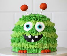 there is a green cake that looks like a monster