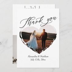 a wedding thank card with a heart shaped photo and the words, thank you on it