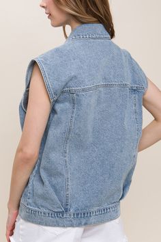 DetailsA denim vest featuring a boxy fit, collar, and functional pockets 100% cotton Casual Dark Wash Sleeveless Denim Vest, Trendy Denim Work Vest, Trendy Denim Workwear Vest, Spring Washed Denim Vest For Work, Spring Washed Denim Vest For Workwear, Trendy Relaxed Cotton Denim Vest, Trendy Relaxed Fit Cotton Denim Vest, Casual Sleeveless Dark Wash Outerwear, Trendy Dark Wash Denim Vest For Work