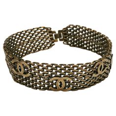 CHANEL by KARL LAGERFELD vintage antiqued bronze toned mesh chainmail choker necklace featuring five CC logos. Secure clasp closure with CC logo. Embossed CHANEL 97 A Made in France. Indicative measurements : length approx. 34 cm (13.39 inches) / widht approx. 2.6 cm (1.02 inches). NOTES - This is a preloved vintage item, therefore it might have imperfections. - Colors may differ slightly from actual product appearance due to differences in lighting conditions. - As a buyer, you are fully respon Choker Necklace Outfit, Chanel Choker, Chainmail Choker, 25 October, Necklace Outfit, Chanel Accessories, Chanel Vintage, Chain Mail, Cc Logo