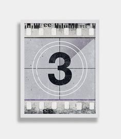 the number three on a film strip in black and white, with an overlay effect