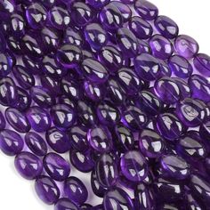 purple glass beads on white background