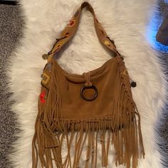 Francesco Biasia Boho Suede Fringe Tan Tote Shoulder Designer Bag New Super Cool With Floral And Metal Charms Details. Inside Pocket. I’ve Small Pen Mark About 1/2” On Back Which I’m Sure Can Be Cleaned And Removed. 12” X 4” X 9.5” 11” Drop Boho Shoulder Bag, Metal Charms, Small Pen, Suede Fringe, Designer Bag, Metal Charm, Super Cool, Inside Pocket, Bags Designer