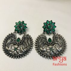 Silver Oxidized Chandbali Studs, Indian Trendy Earrings Made in Brass with Oxidized Silver Finish and colored stones Very Elegant and stylish, these earrings can be paired with any traditional Indian or Western Attire depending upon the occasion and the theme. Length: Approx. 2.25 Inches Light-weight Earrings come with Push Back Closure In-stock & ready-to-ship **Color may vary slightly due to photography and lighting. Pick-up available for this item at 5336 Heather Brook Ln. Glen Allen, 23059, Fusion Style Green Chandbalis For Gift, Fusion Style Green Chandbalis As Gift, Green Earrings For Diwali, Handmade Green Earrings For Diwali, Oxidized Finish Round Earrings For Diwali, Oxidized Round Earrings For Diwali, Diwali Oxidized Round Earrings, Green Oxidized Finish Earrings For Festive Occasions, Green Earrings With Oxidized Finish For Festive Occasions