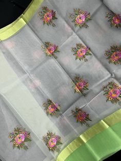 Very Soft and Elegant Saree!Floral Embroidery Saree in Grey Color with Raw Silk Patta on the Borders in Lime Green Color with beautiful Tassels. Embroidery Flower on the body. Saree has half Length embroidery towards the other end of the Saree. Please see the last picture for reference. Please note -: Material is Transparent. Color : Grey with Lime GreenBase Fabric : Banarasi Kora / Organza Blouse piece : Comes with Blouse piece.Fall & Edging done (Yes/No) : Yes Disclaimer -:- Color variation is Anarkali Set With Floral Embroidery In Tissue Silk, Green Raw Silk Anarkali Set With Floral Embroidery, Tissue Silk Blouse Piece With Floral Embroidery, Traditional Anarkali Set With Floral Embroidery In Tissue Silk, Pista Green Traditional Wear With Floral Embroidery, Chanderi Dupatta With Floral Embroidery, Traditional Pista Green Organza Blouse Piece, Green Tissue Silk Sets With Floral Embroidery, Diwali Floral Embroidered Raw Silk Anarkali Set